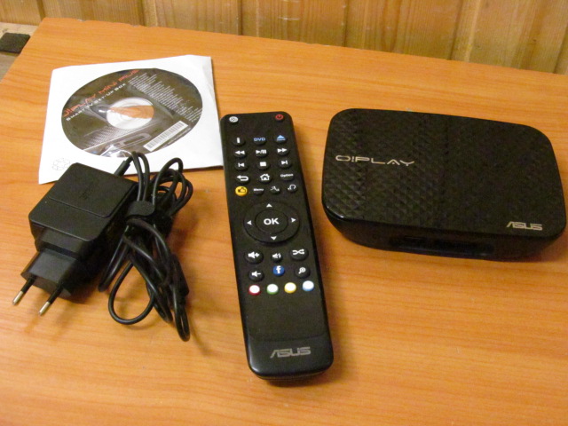 Медиаплеер ASUS O!Play Mini Plus /1080p (Full HD) /HDMI /Wi-Fi /USB /Ethernet /e-SATA /Optical S/PDIF /поддержка IPTV /SD /Memory Stick /MKV, H.264, FLAC /Диск, Пульт ДУ